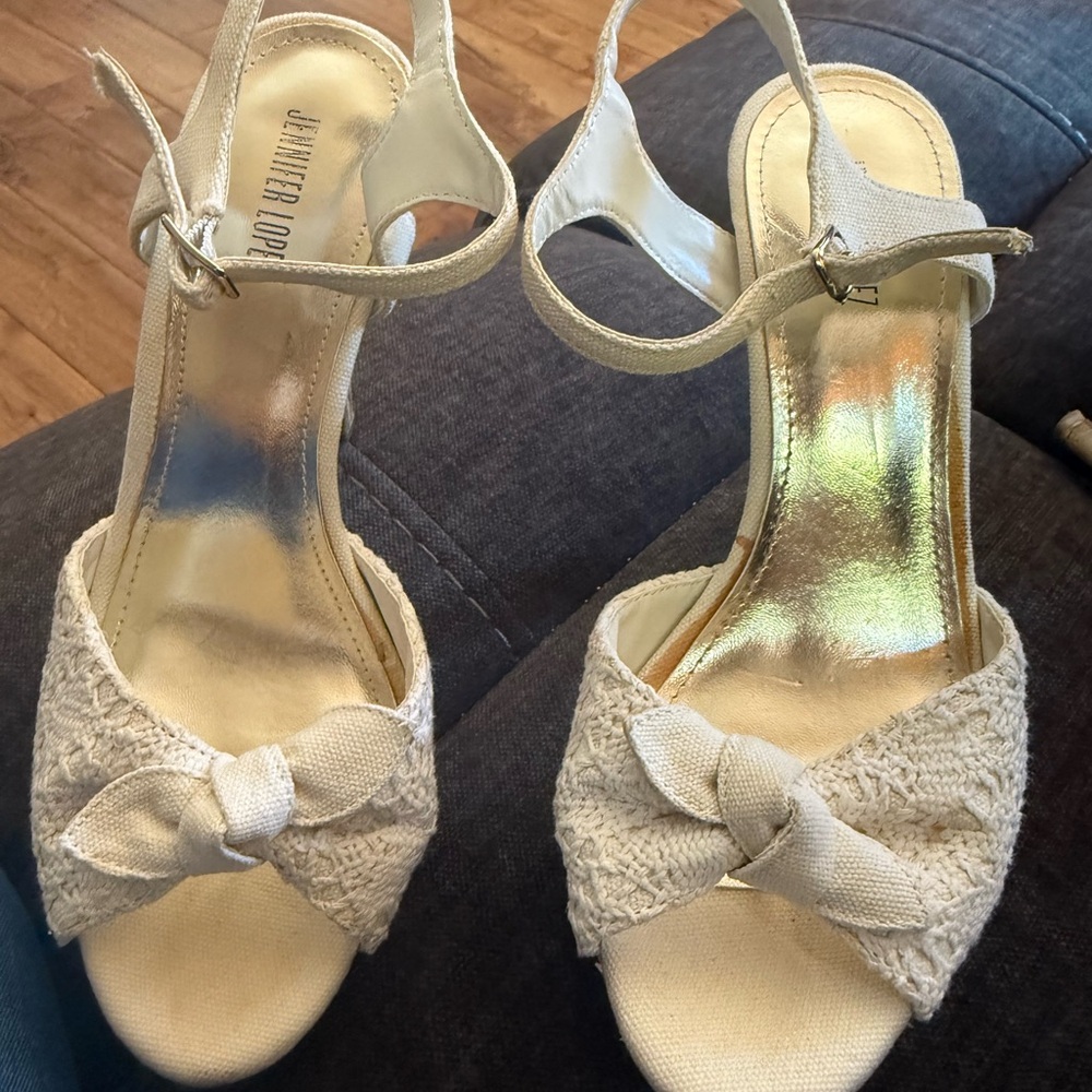 Jennifer Lopez Cream Heels with Ankle Strap and Decorative Bow